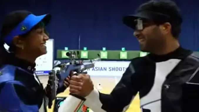 Gun shooting gold medal